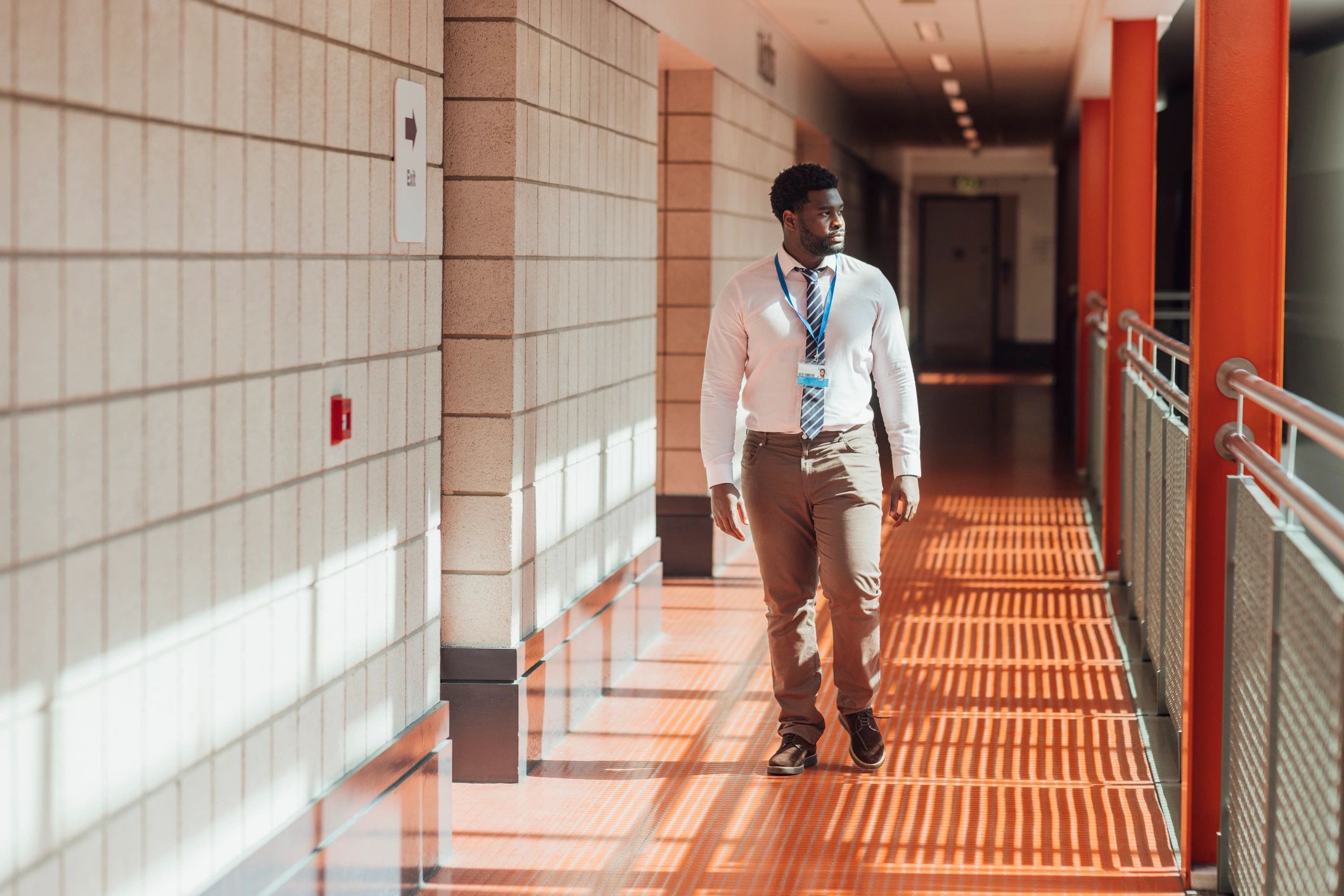 Professional walking through a modern building